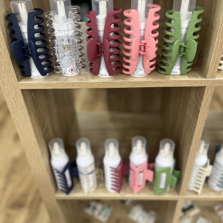 assorted hair clips around product bottles